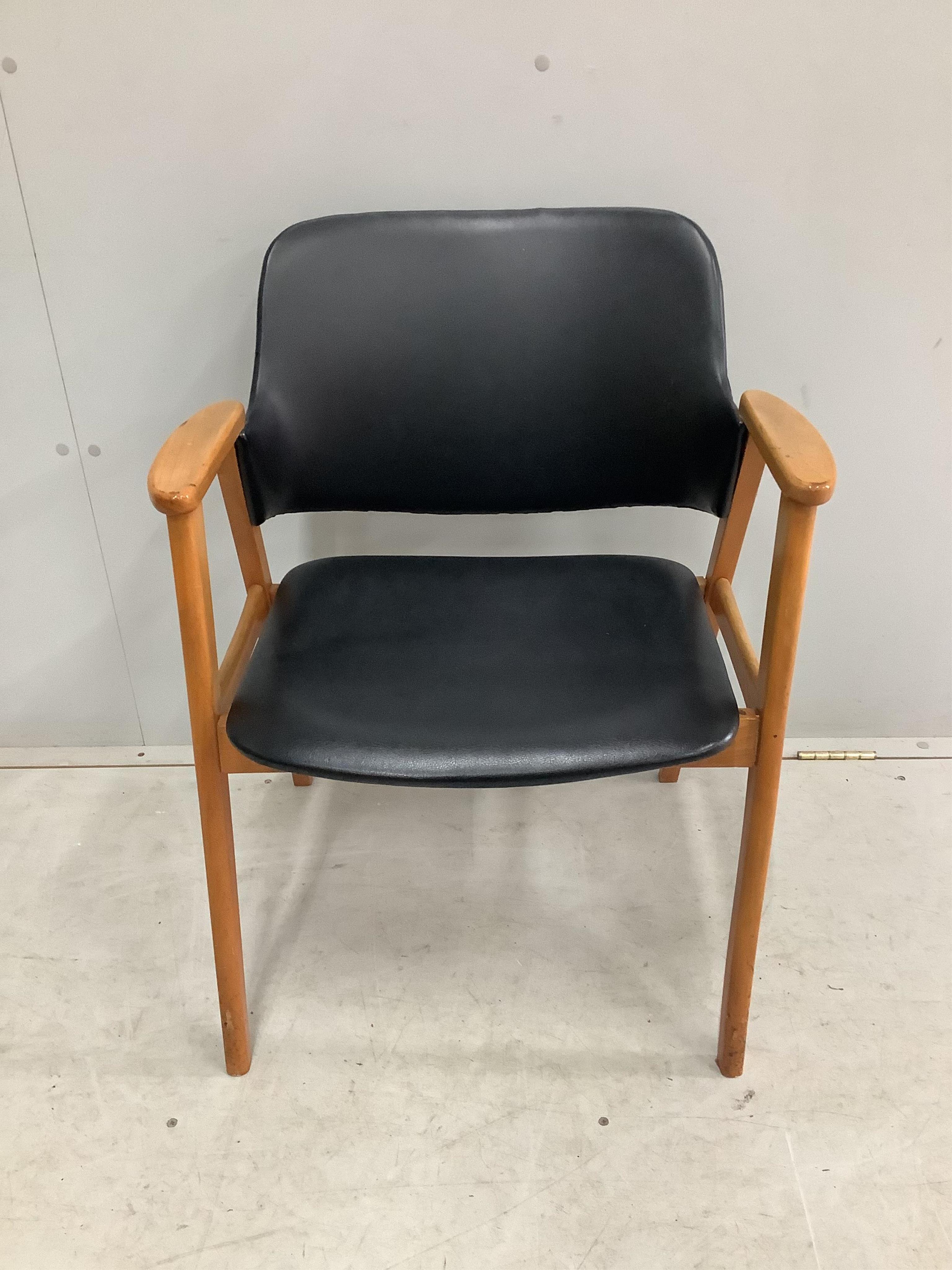 A mid century Danish Teak and Leather arm chair by Erik Kirkegaard for Glostrup, width 61cm, depth 43cm, height 75cm. Condition - fair to good